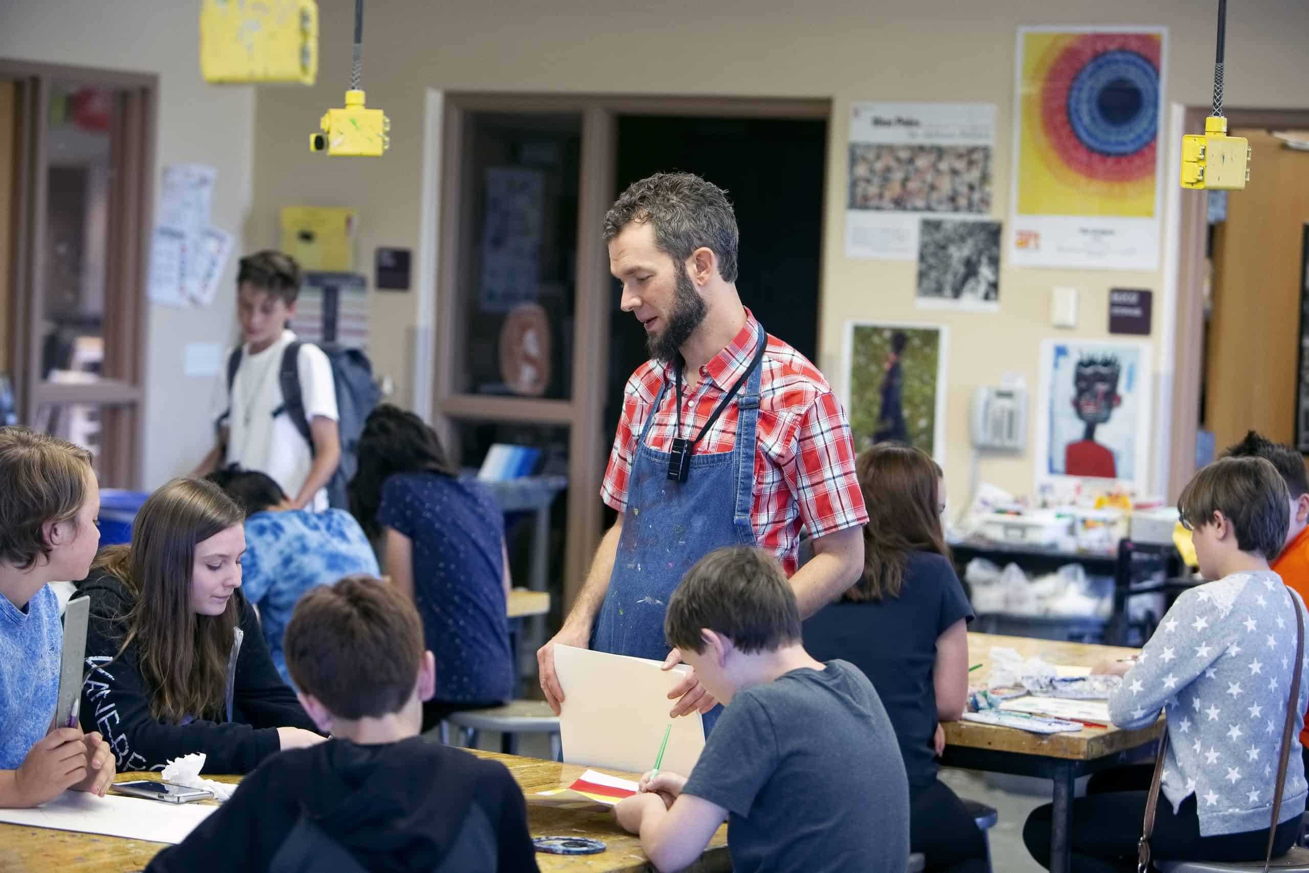 A teacher helping students