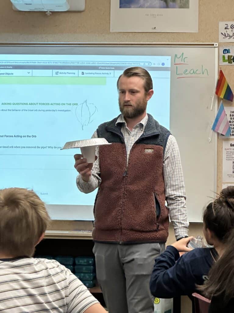 Is it magic? Nope, science! Mr. Leach discusses the different forces acting on the tinsel orb to cause it to levitate with his 6th-grade science class