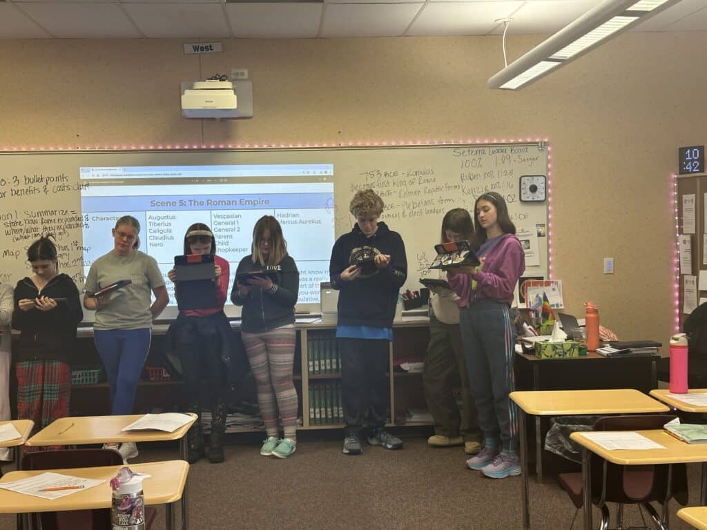 Seventh-grade social studies students are acting scenes from the Roman Empire.