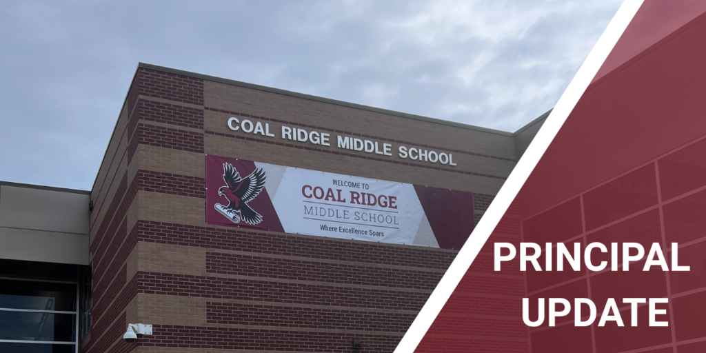 Exterior view of Coal Ridge Middle School with a welcoming banner and a cloudy sky in the background.