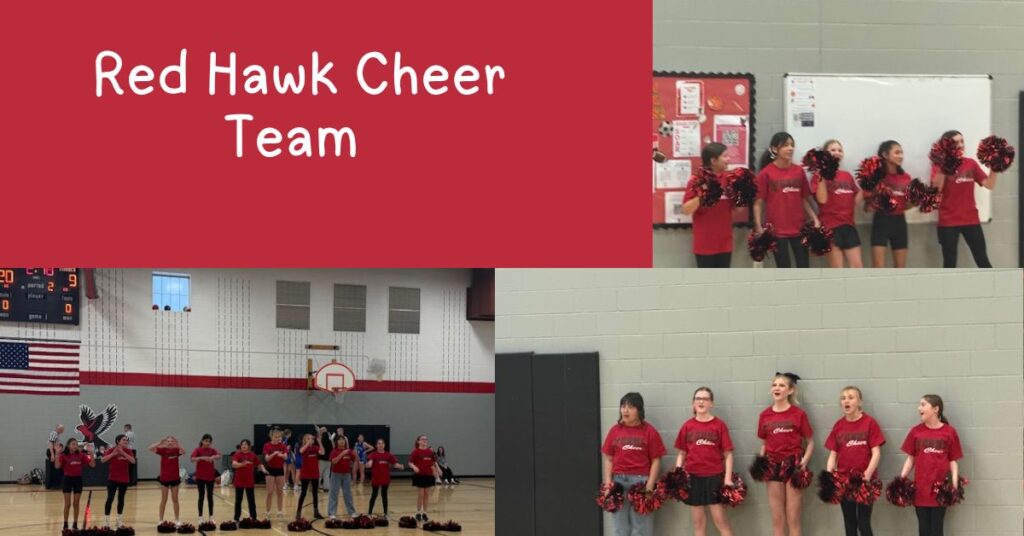 Red Hawk Cheer Team performing in a gym, wearing red shirts and holding pom-poms, with a scoreboard in the background.