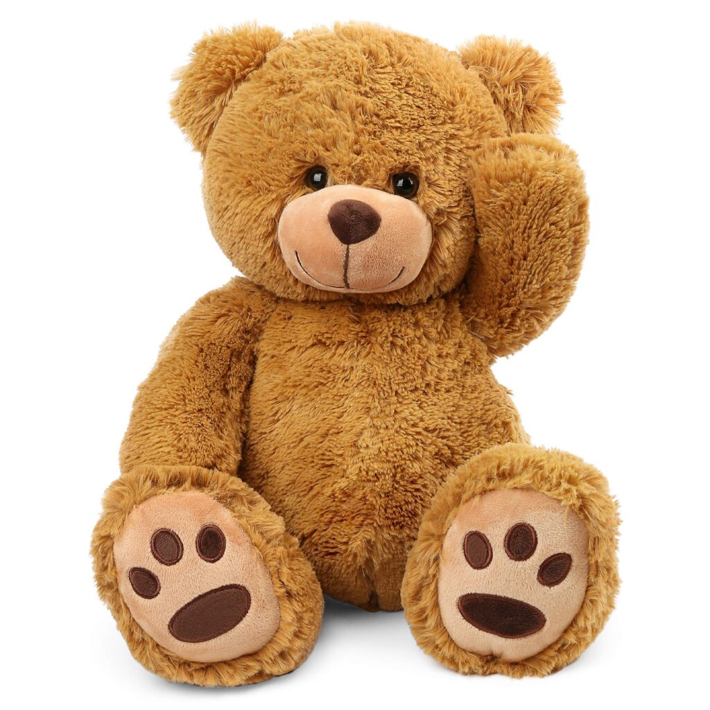 A soft, brown teddy bear with a friendly expression, sitting upright and waving with one paw.